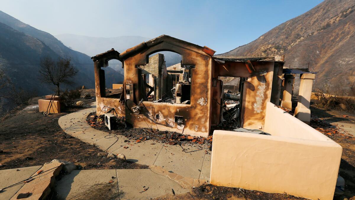 A charred is all that remains of a home along Little Tujunga Canyon Road near Santa Clarita after the Sand fire swept through the area on Sunday.