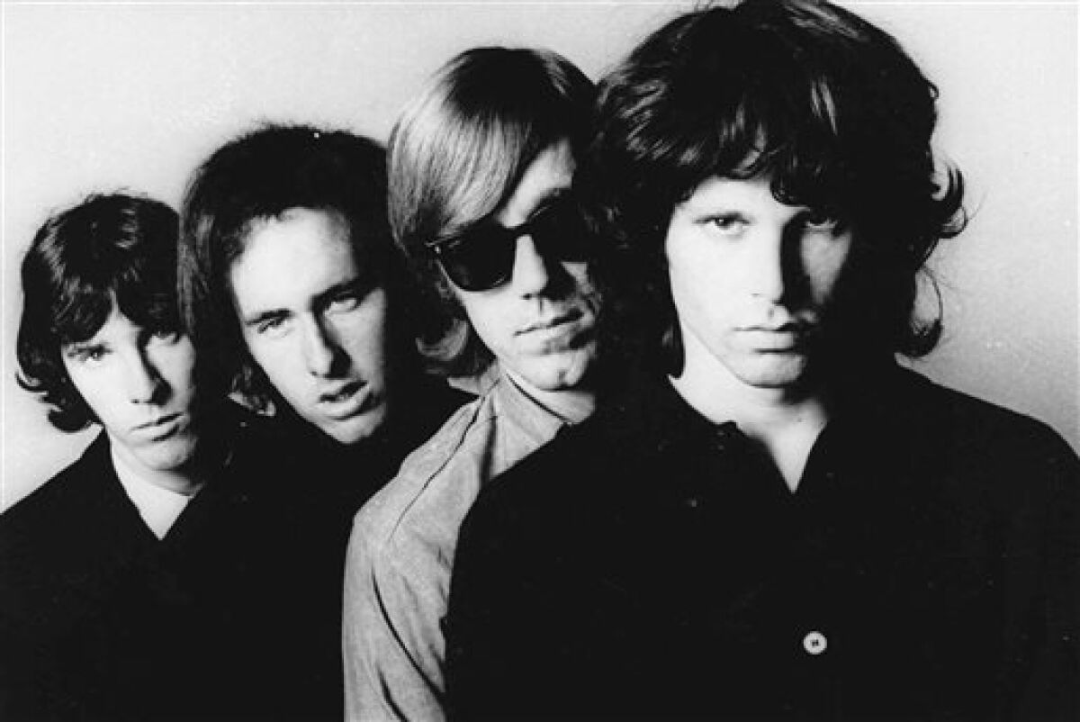 FILE - In this undated publicity file photo, members of the Doors, from left, John Densmore, Robbie Krieger, Ray Manzarek and Jim Morrison, pose for a portrait. Manzarek, the keyboardist who was a founding member of The Doors, has died at 74. Publicist Heidi Robinson-Fitzgerald says in a news release that Manzarek died Monday, May 20, 2013, at the RoMed Clinic in Rosenheim, Germany, surrounded by his family. (AP Photo, File)