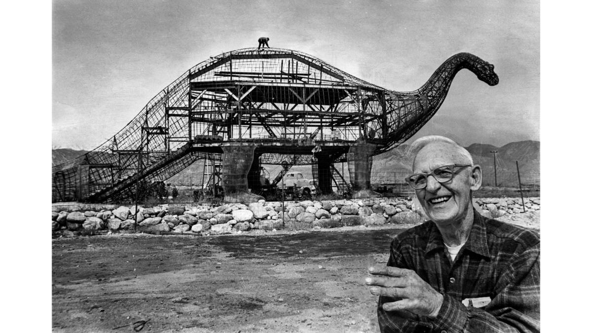 March 23, 1970: Sculptor Claude K. Bell with his 45-foot-tall, 150-foot-long brontosaurus in Cabazon.