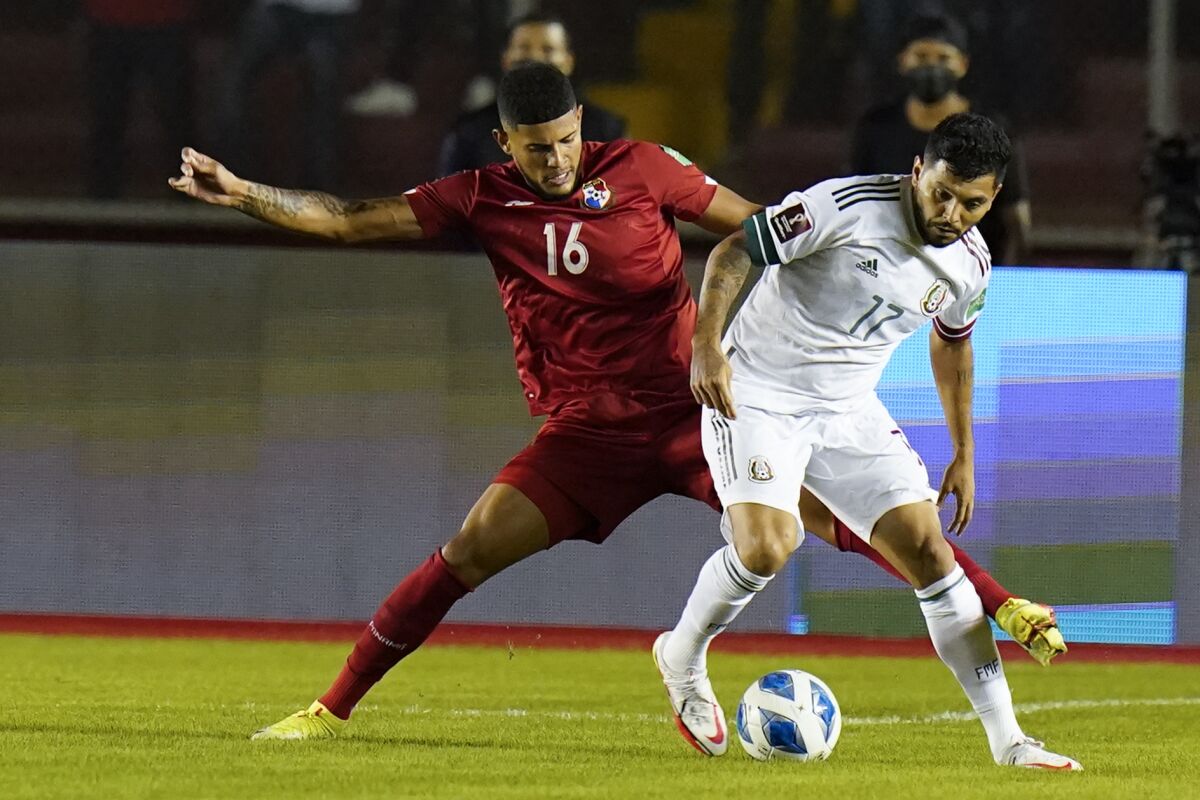 Panama's Andres Andrade battles Mexico's Jesus Corona for possession of the soccer ball.