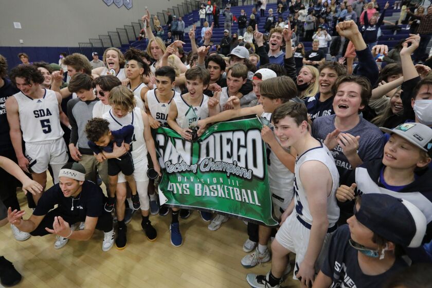 January 21, 2022, San Marcos, California, USA_| Prep basketball, CIF Div. 3 championship- Scripps Ranch vs. San Dieguito Academy_| San Dieguito Academy players and their fans celebrate their victory. |_Photo Credit: Photo by Charlie Neuman