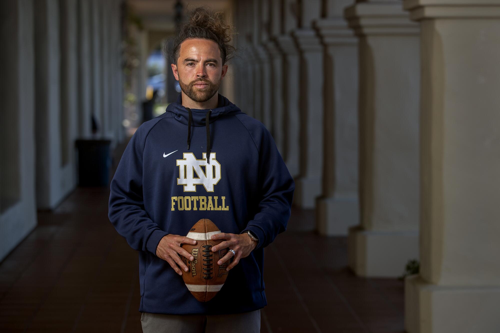 Notre Dame High football coach Evan Yabu poses for a photo on campus.