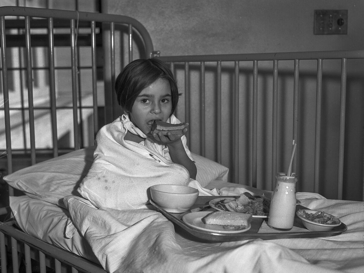 Nov. 28, 1935: Mary Louise Varela has Thanksgiving dinner in her bed at General Hospital. She eats her pumpkin pie first.