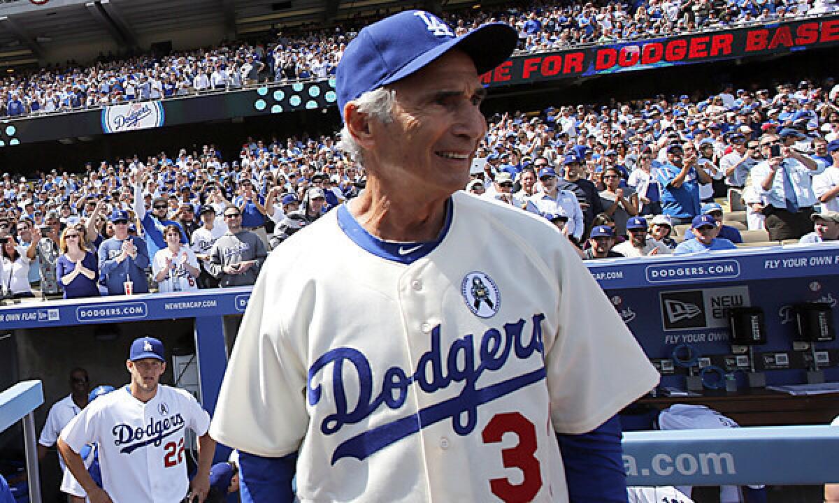 Dodgers legend Sandy Koufax was hit in the head with a foul ball during a Dodgers spring training practice session on Friday.
