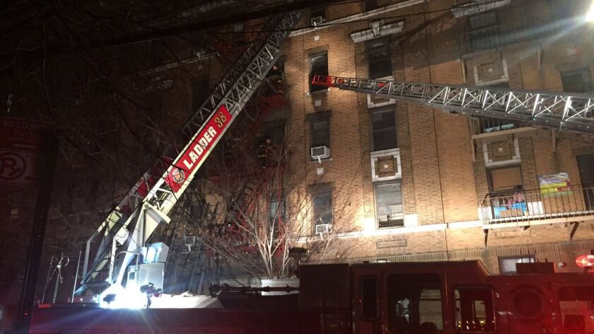 New York firefighters battle a fatal blaze at an apartment building in the Bronx.