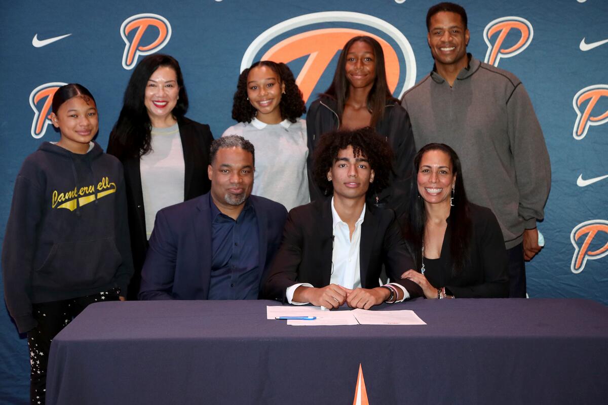 Pacifica Christian Orange County's Houston Mallette, bottom center, smiles with family members on Thursday.