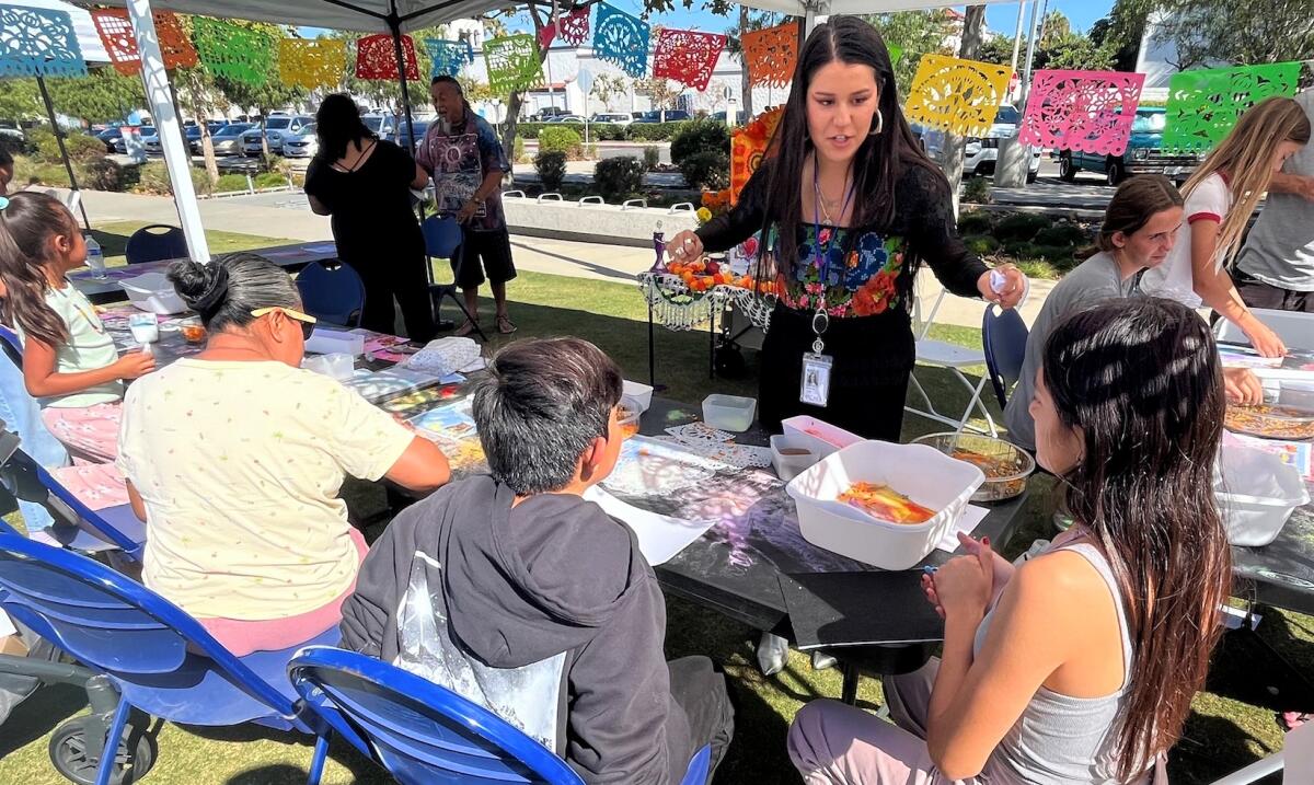 Youth and adults participate in an art-making activity at Costa Mesa's ARTventure in 2023. 