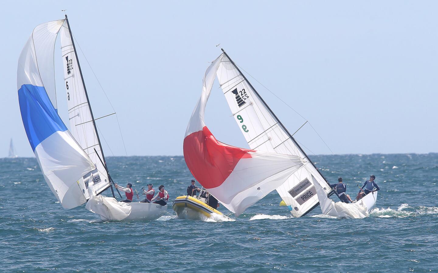 The mast of the The Royal Danish Yacht Club Crew, with skipper Harry Price, right, dips into the water after breaking the mast as they race Leonard Takahashi's crew from San Diego Yacht Club during Governor's Cub final on Saturday.