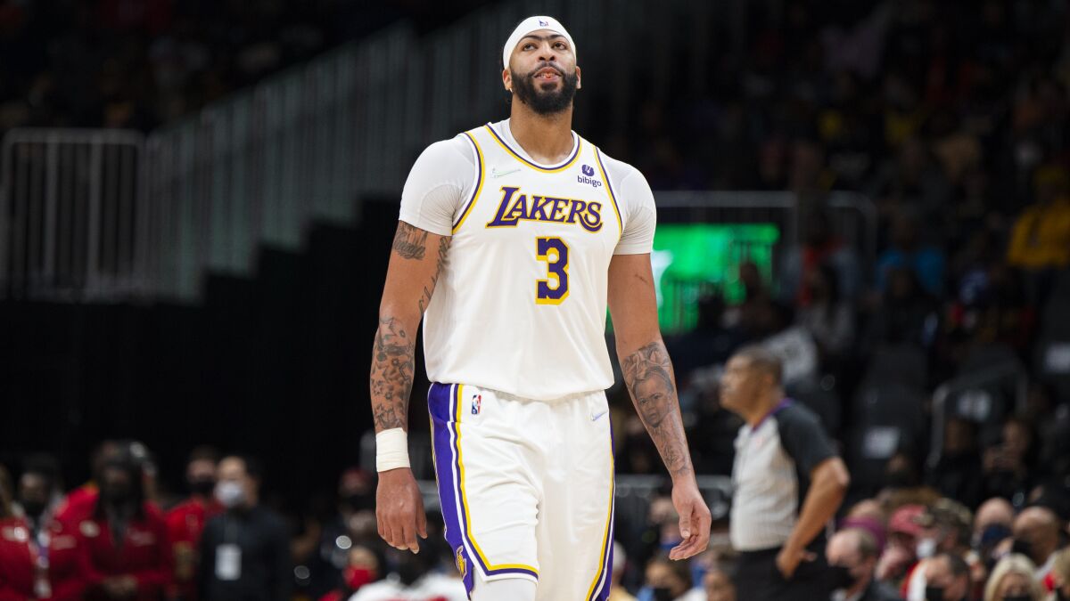 Lakers star Anthony Davis stands on the court during a loss to the Atlanta Hawks on Sunday.