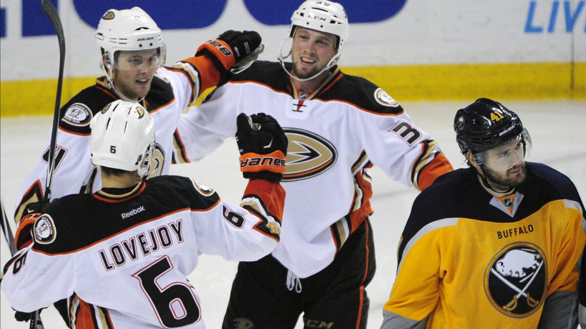 Ducks forward Matt Beleskey, top center, celebrates with teammates Ben Lovejoy, bottom, and Cam Fowler after scoring during a win over the Buffalo Sabres on Oct. 13.