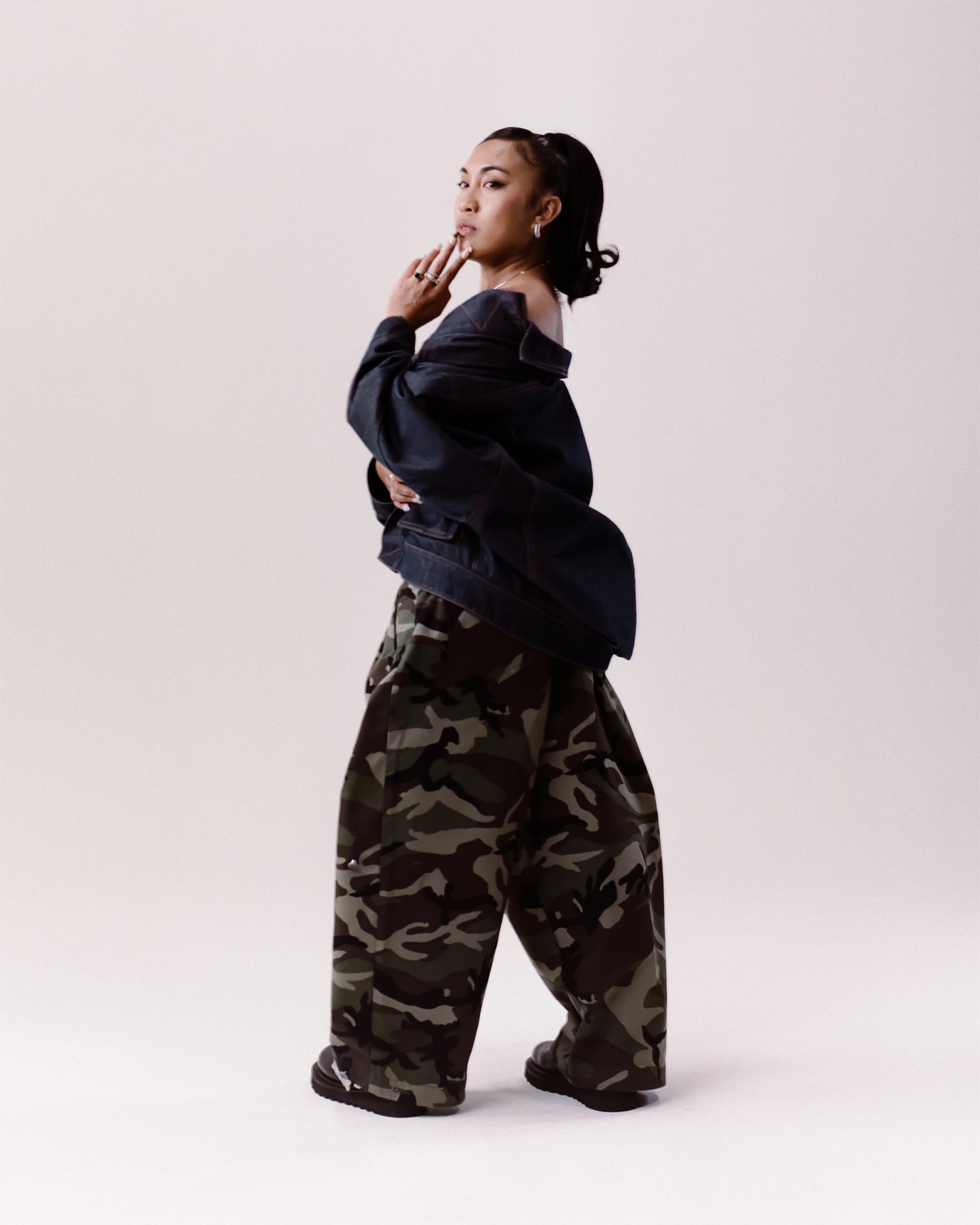 Micah wears Art Community Reversible 7 Pocket Japanese Denim overgarment and Camo Japanese Twill pants, Maaari Lunar collar and