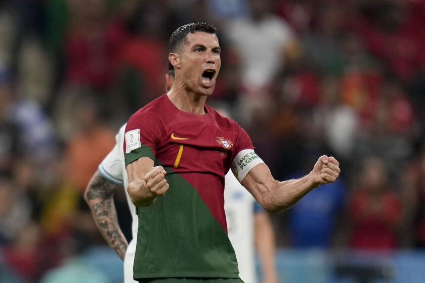 Portugal's Cristiano Ronaldo celebrates his side's opening goal during the World Cup group H soccer match between Portugal and Uruguay, at the Lusail Stadium in Lusail, Qatar, Monday, Nov. 28, 2022. (AP Photo/Aijaz Rahi)