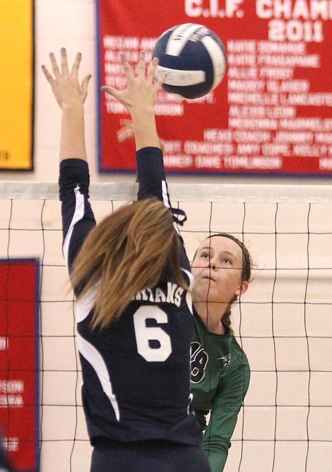 Sage Hill's Jamie Dailey (18) puts the ball past a St. Margaret's middle blocker for a point on Tuesday.