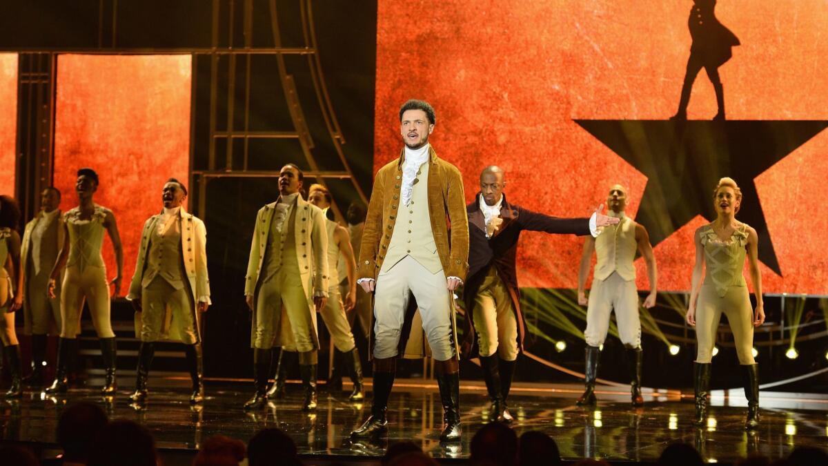 The cast of Hamilton performs during the Olivier Awards on Sunday at London's Royal Albert Hall.