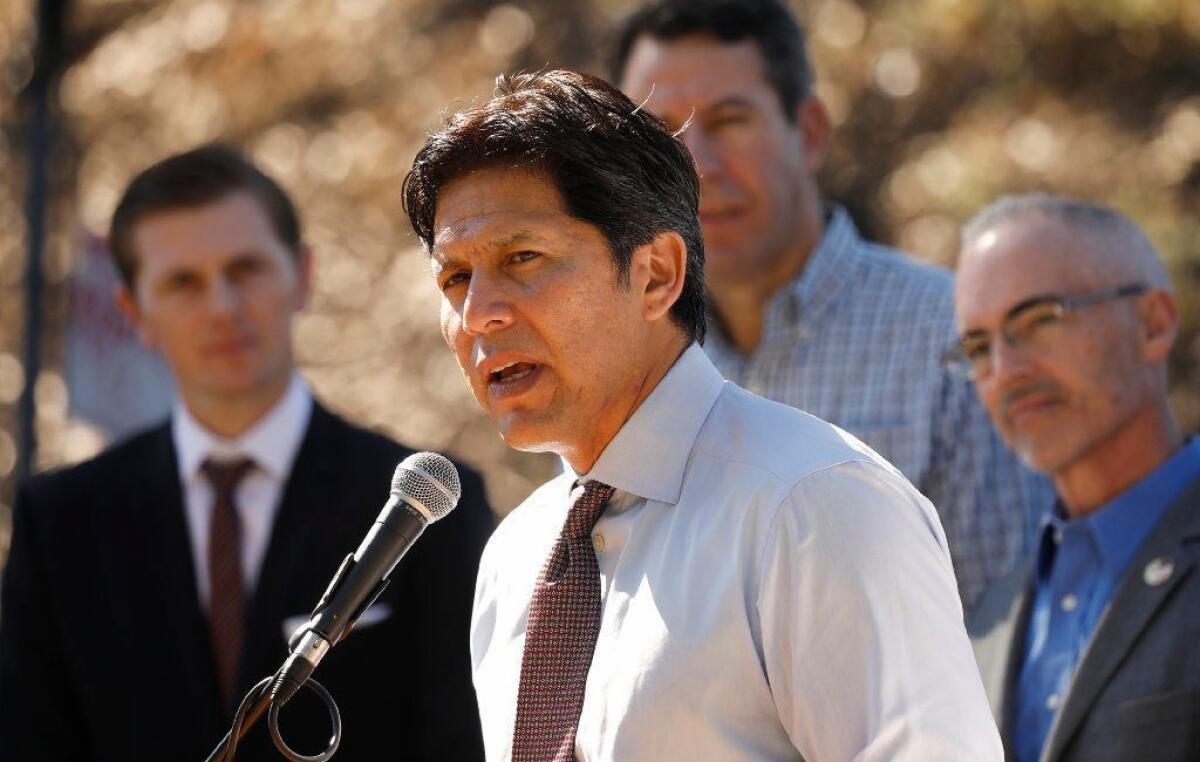 Former state Sen. Kevin de León, pictured at an October news conference, wants to reduce emissions in a way that helps low-income and minority communities.