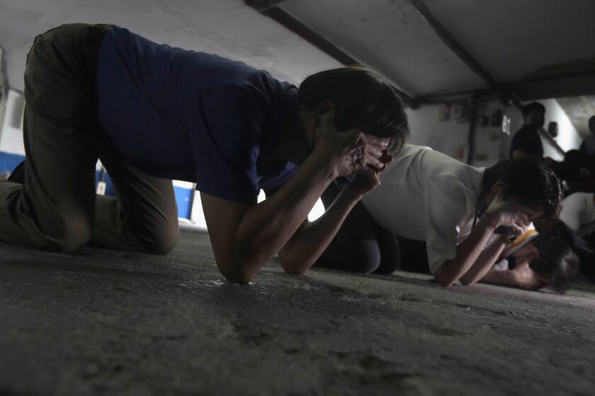 Taiwanese people take cover inside of a basement shelter during the Wanan air raid drill, in Taipei, Taiwan, Monday, July 25, 2022. Taiwan’s capital staged air raid drills Monday and its military mobilized for routine defense exercises, coinciding with concerns over a forceful Chinese response to a possible visit to the island by U.S. Speaker of the House Nancy Pelosi. (AP Photo/Chiang Ying-ying)