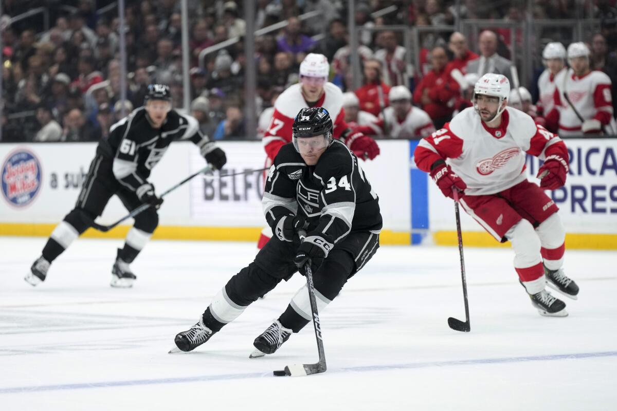 Kings forward Arthur Kaliyev controls the puck against the Detroit Red Wings at Crypto.com Arena.