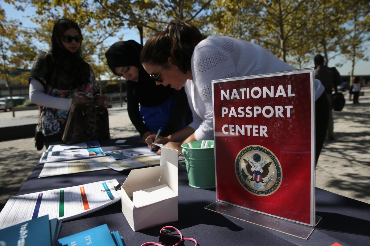 Newly naturalized Amerian citizens had an opportunity last Thursday to apply for U.S. passports at Liberty State Park in Jersey City, N.J. You can do the same when the L.A. Passport Office opens Saturday for walk-in applicants.
