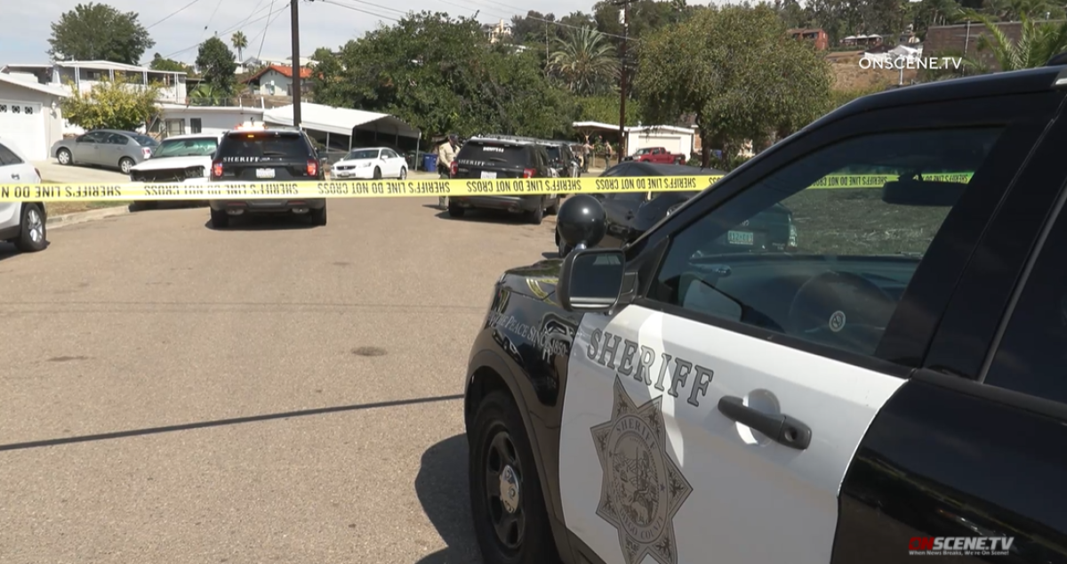 Sheriff's deputies investigate a shooting Tuesday afternoon on Eileen Street in the La Presa area of Spring Valley.