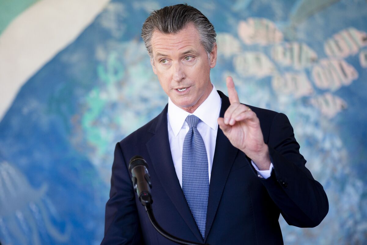 California Gov. Gavin Newsom speaks during a news conference at Carl B. Munck Elementary School, Wednesday, Aug. 11, 2021, in Oakland, Calif. Gov. Newsom announced that California will require its 320,000 teachers and school employees to be vaccinated against the novel coronavirus or submit to weekly COVID-19 testing. The statewide vaccine mandate for K-12 educators comes as schools return from summer break amid growing concerns of the highly contagious delta variant. (Santiago Mejia/San Francisco Chronicle via AP, Pool)
