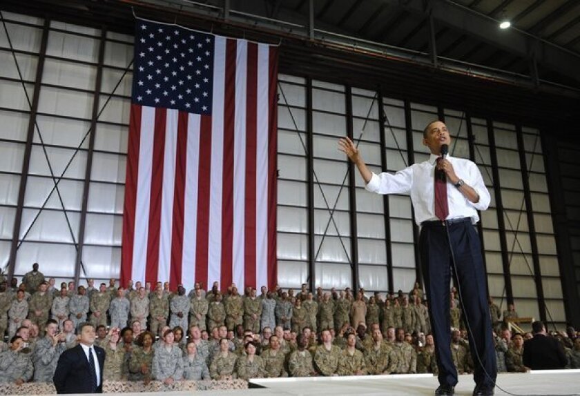 President Obama speaks to troops during a surprise visit to Bagram air base in Afghanistan.