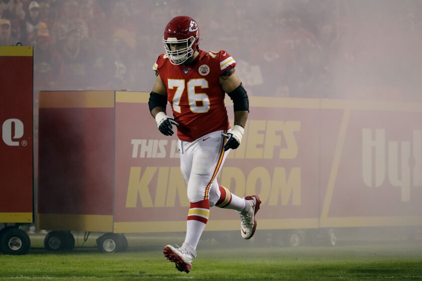 Kansas City Chiefs offensive guard Laurent Duvernay-Tardif runs onto the field before an NFL football game against the Green Bay Packers Sunday, Oct. 27, 2019, in Kansas City, Mo. (AP Photo/Charlie Riedel)
