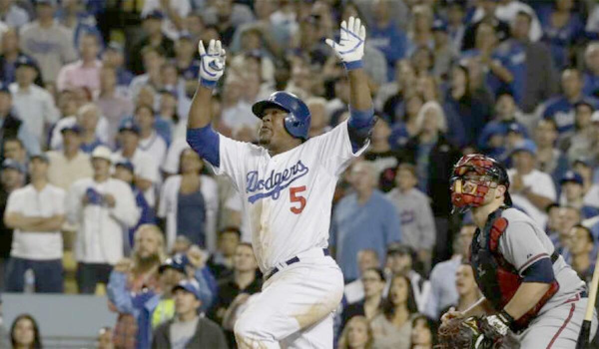 Third baseman Juan Uribe will return to the Dodgers next season after agreeing to a new two-year contract with the team.