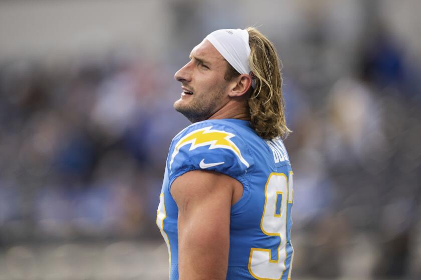 Los Angeles Chargers linebacker Joey Bosa (97) looks on before an NFL football game against the Los Angeles Rams, Sunday, Jan. 1, 2023, in Inglewood, Calif. (AP Photo/Kyusung Gong)