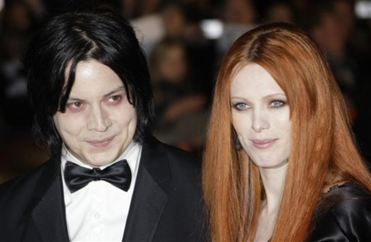 FILE - In this Oct. 29, 2008 file photo, musician Jack White, left, and Karen Elson arrive on the red carpet for the Royal World Premiere of the 22nd James Bond film, "Quantum of Solace" in London. White and Elson announced Friday, June 10, 2011 that they are splitting. (AP Photo/Joel Ryan, file)