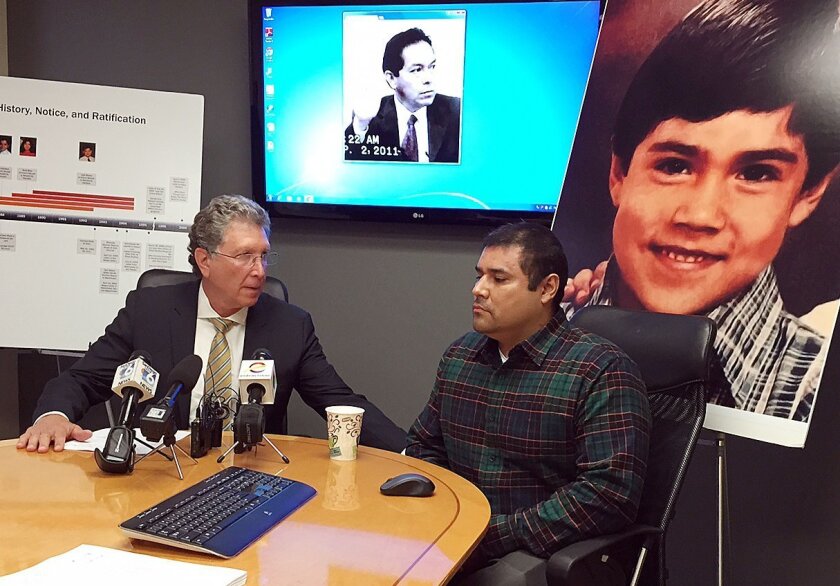 Lawyer Irwin Zalkin (left) and Jose Lopez speak to the media about a $13.5 million judgment against the governing body of the Jehovah's Witness church. Lopez was a boy when a church leader molested him.