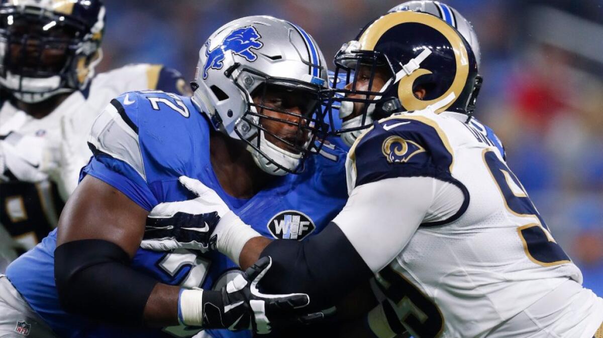 Rams defensive tackle Aaron Donald is blocked by Lions guard Laken Tomlinson during Oct. 16 game.