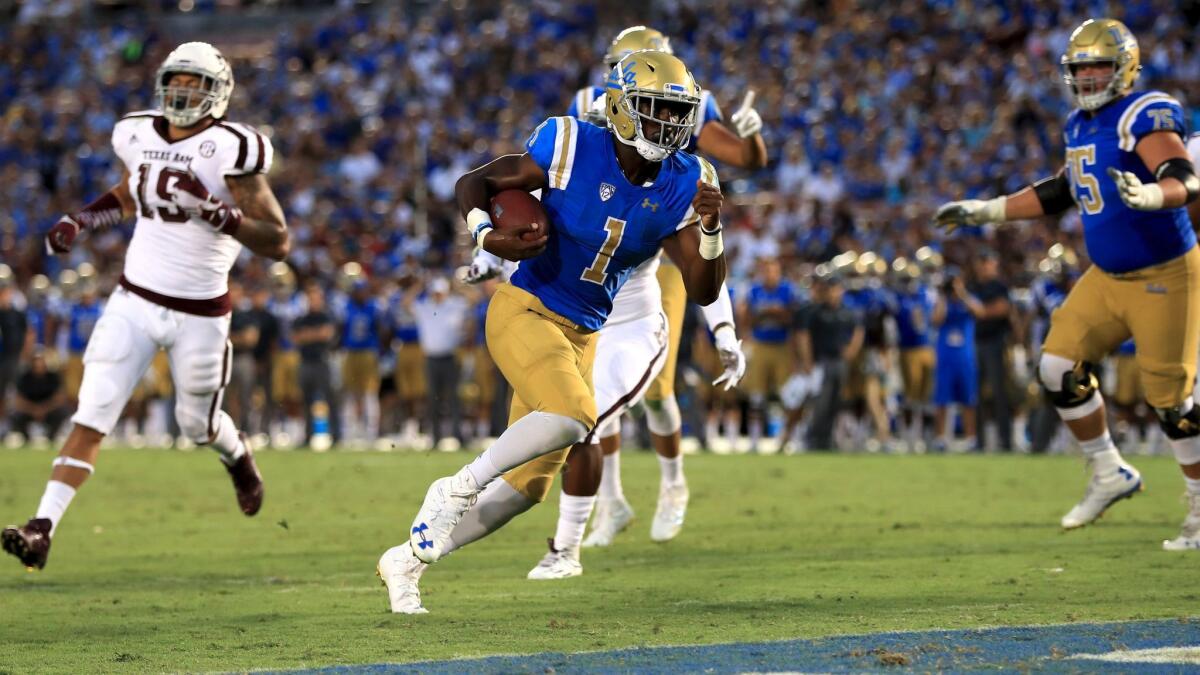 UCLA's Soso Jamabo rushes for a touchdown against Texas A&M at the Rose Bowl on Sept. 3.