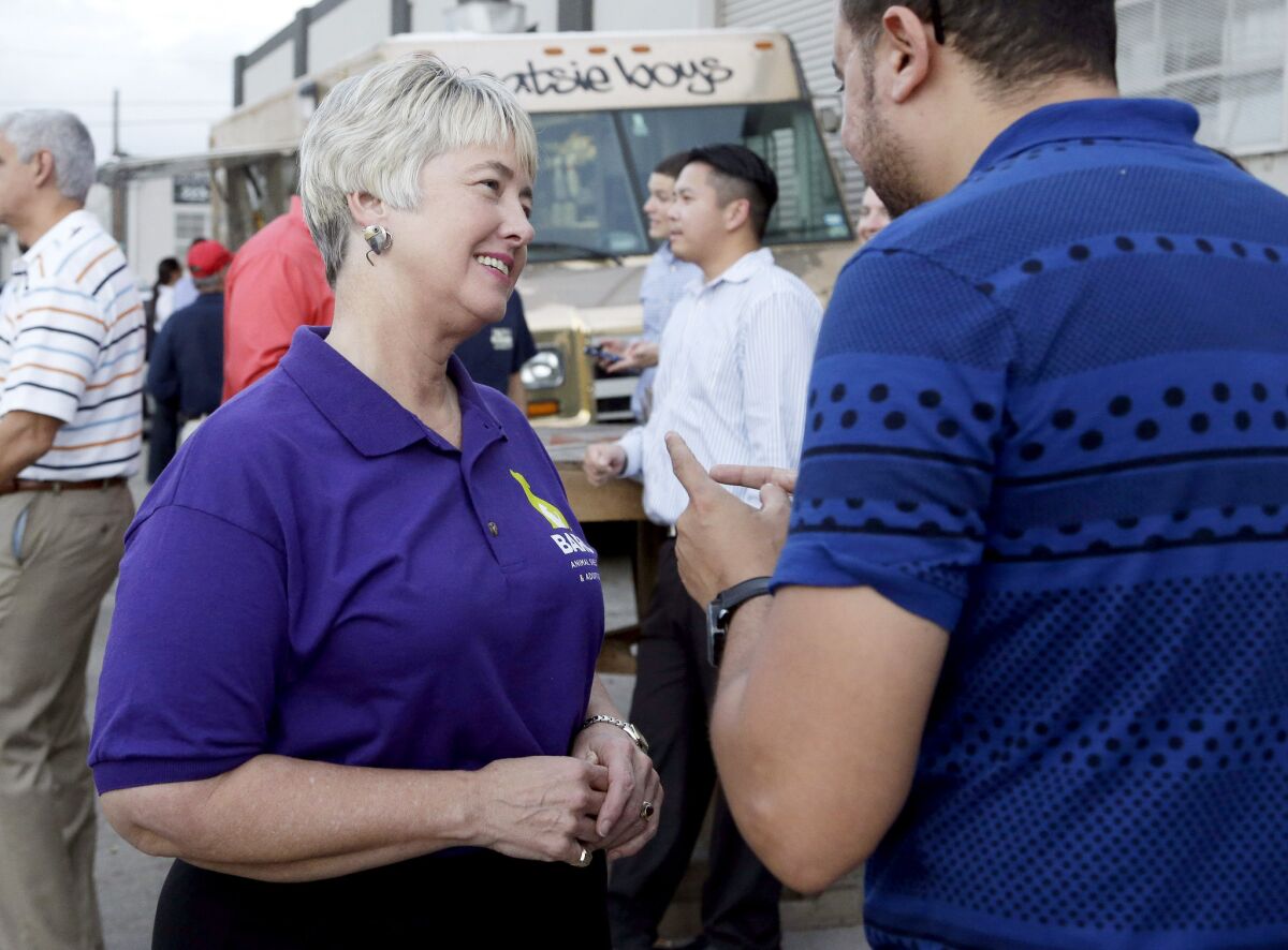 Houston Mayor Annise Parker greets a supporter at a fundraiser for the Houston Equal Rights Ordinance.
