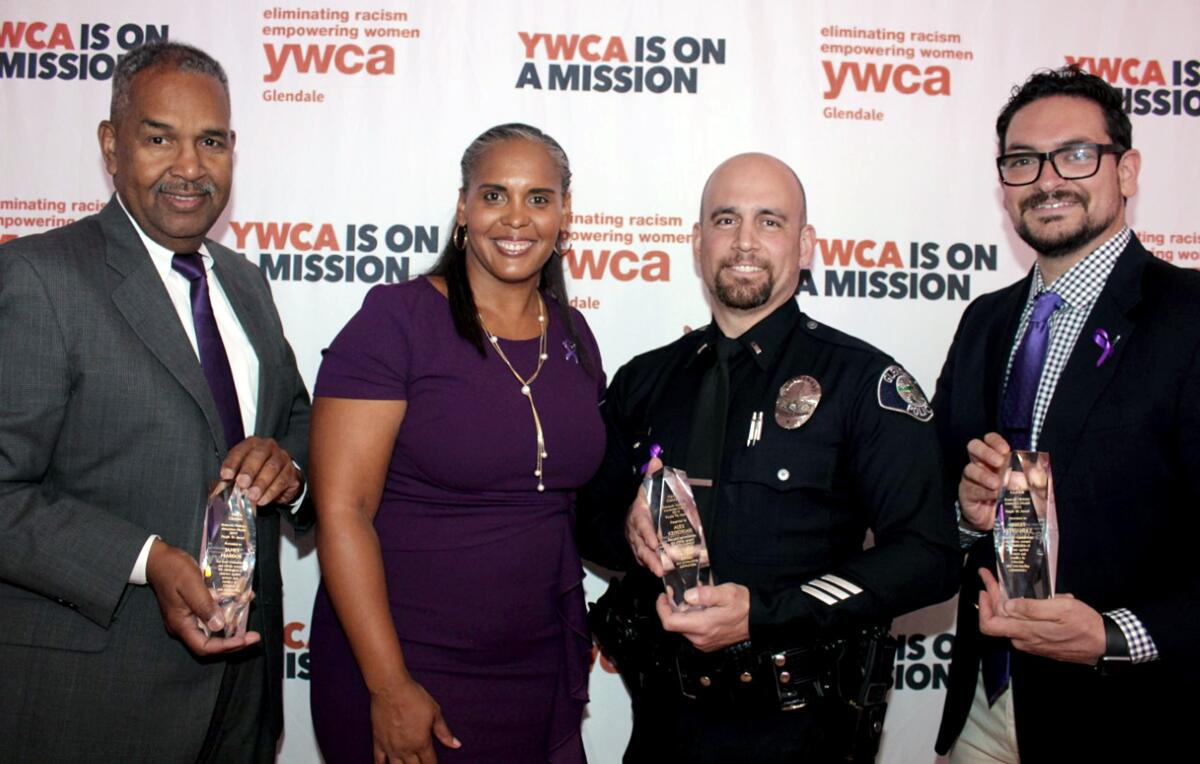 Joining Tara Peterson, YWCA Glendale's executive director, at the 2019 Purple Tie Awards, are three men noted for their efforts against domestic violence. They are, from left, James Maddox, YWCA volunteer; Sgt. Alex Krikorian, Glendale Police Department; and Albert Hernandez, executive director of Family Promise of the Verdugos.