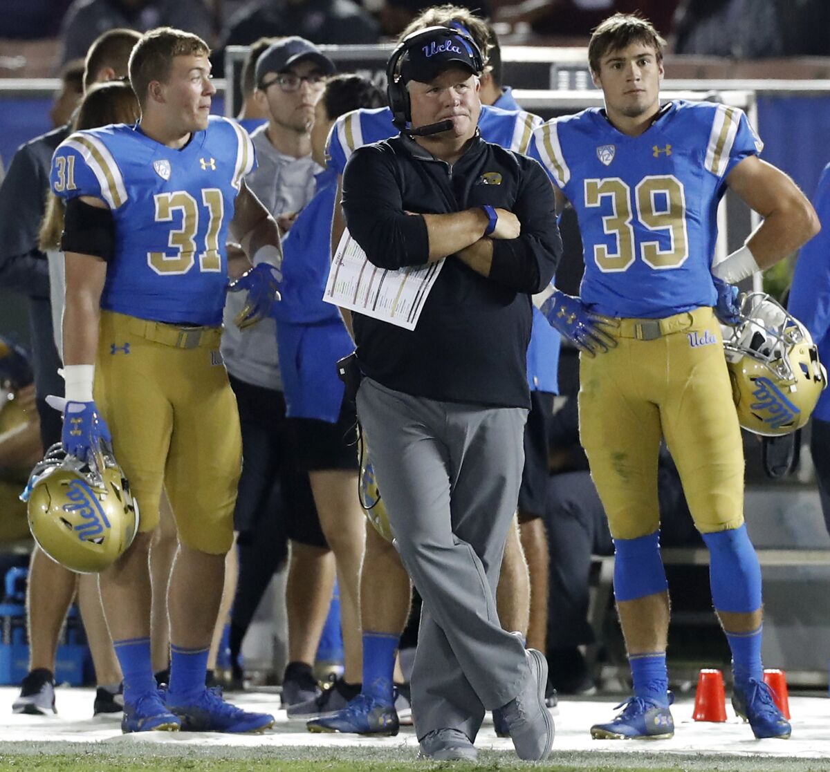 UCLA head coach Chip Kelly watches the closing minutes of a 24-21 loss to the Washington on Oct. 6 at the Rose Bowl.