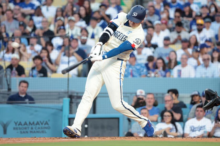LOS ANGELES, CALIFORNIA-Dodgers Shohei Ohtani hits a two-run home run against the Angels in the third inning at Dodgers Stadium Saturday. (Wally Skalij/Los Angeles Times)