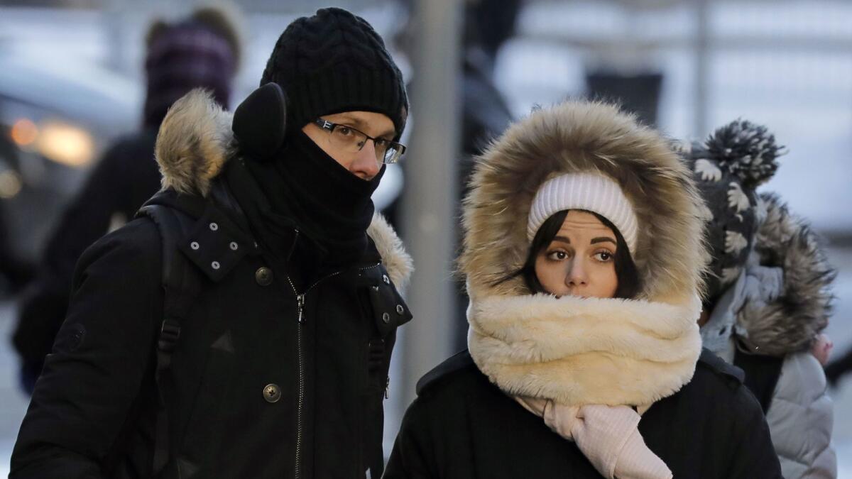 Pedestrians bundle up against the sub-zero temperatures in New York, on Jan. 6, 2018. A massive cold front hit the Eastern Seaboard.
