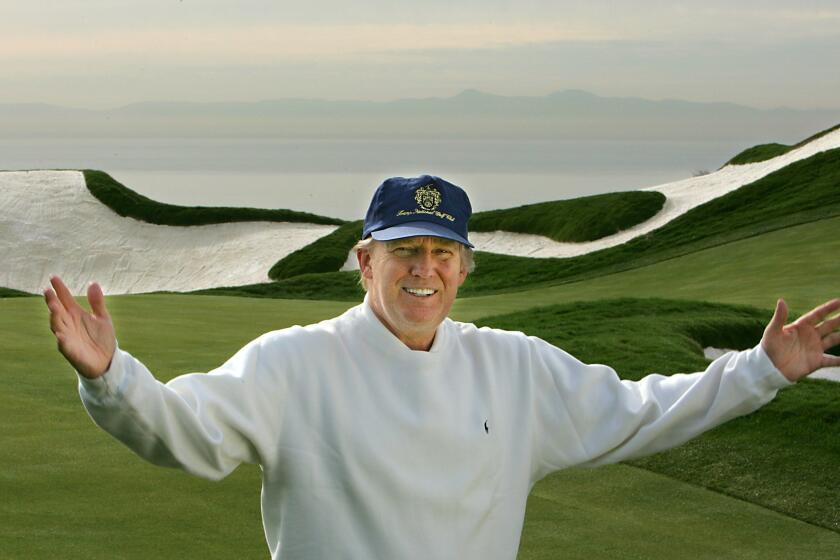 In this 2005 photo, real estate mogul Donald Trump shows off the golf course he purchased on the Palos Verdes Peninsula.