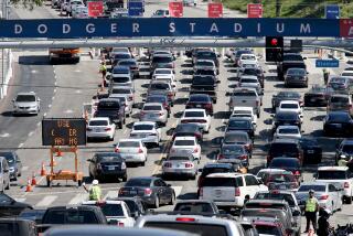 LOS ANGELES, CALIF. - OCT. 10, 2016. Motor traffic streams in to the parking lot of Dodger Stadium.