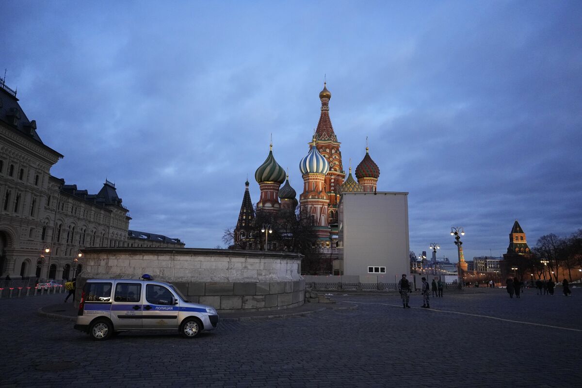 FILE - A police car is parked in Red Square, with St. Basil's Cathedral in the background, in Moscow, Russia, March 4, 2022. (AP Photo, File)
