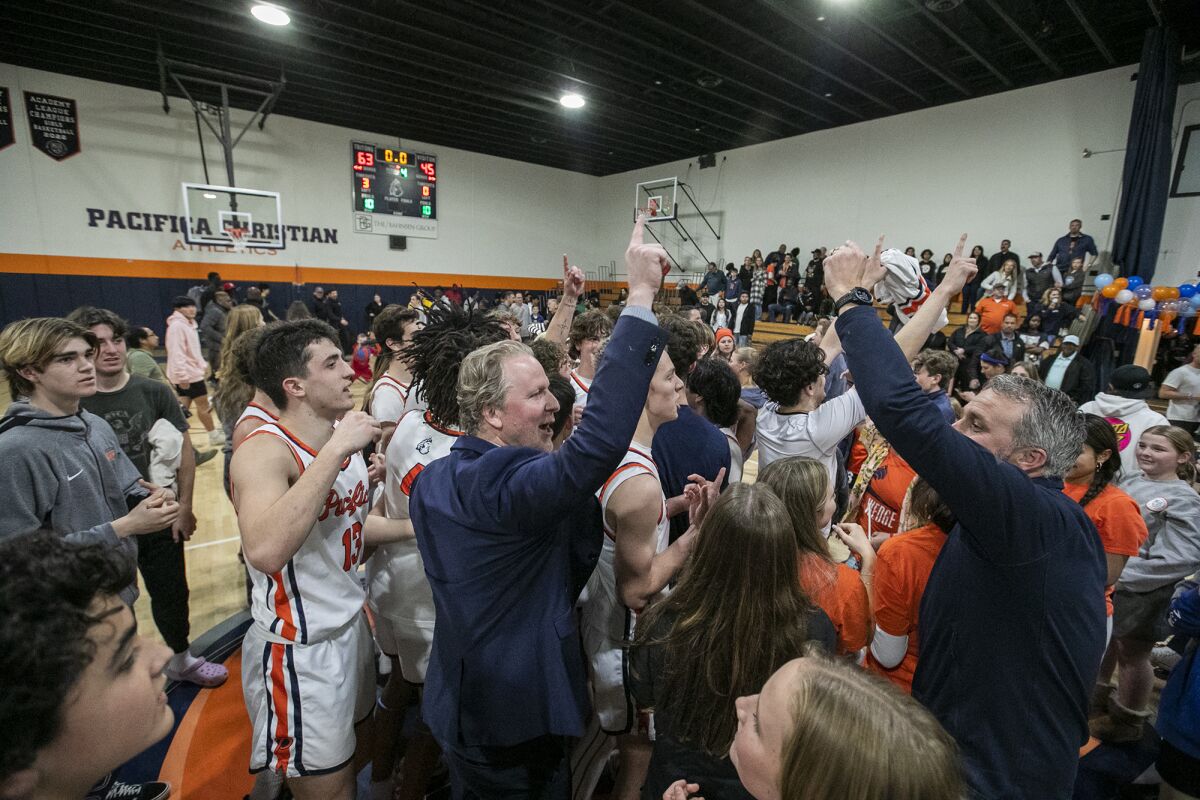 Pacifica Christian Orange County head coach Jeff Berokoff celebrates with his team after beating Fairmont Prep on Friday.