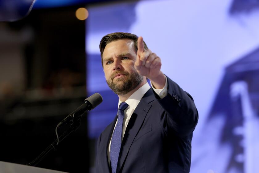 MILWAUKEE, WI JULY 17, 2024 --- Republican vice presidential candidate Sen. J.D. Vance speaks during the Republican National Convention on Wednesday, July 17, 2024. Vance's mom Beverly back right. (Robert Gauthier / Los Angeles Times)
