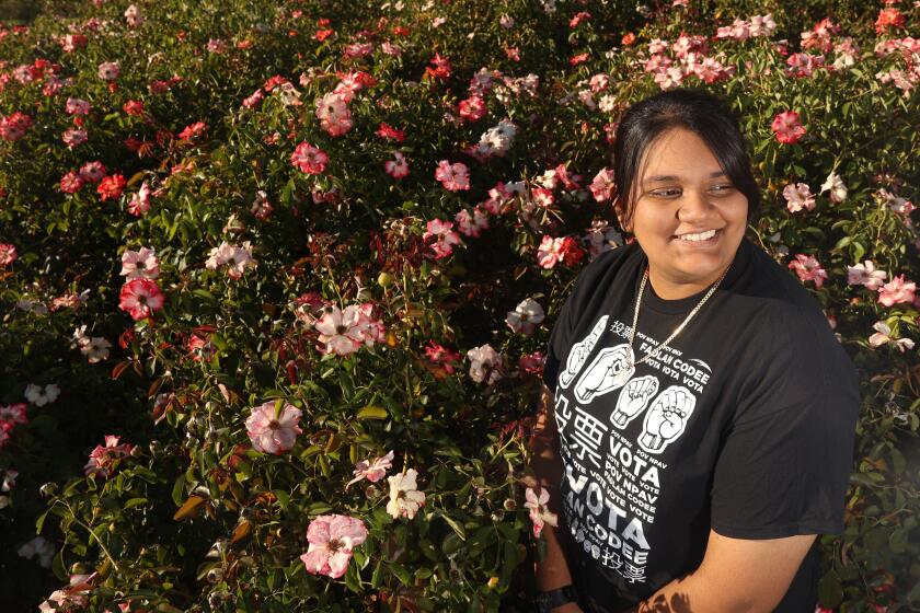 Los Angeles, CA - August 24: Cimate Change Activist/Essayist Alyssa Jaipersaud poses for a portrait at Exposition Park Rose Garden on Saturday, Aug. 24, 2024 in Los Angeles, CA. (Michael Blackshire / Los Angeles Times)