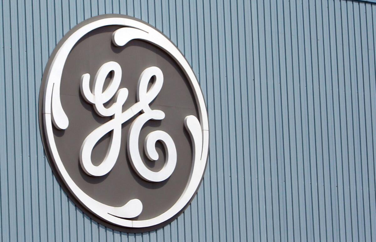 General Electric Co. reported a decline in third-quarter profit, but strong performances from its core units helped the company top Wall Street expectations.