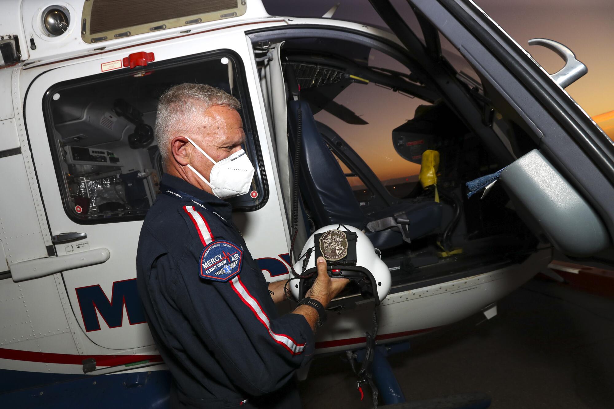 Mercy Air helicopter ambulance pilot Michael Bobeck prepares for a flight at Imperial County Airport.