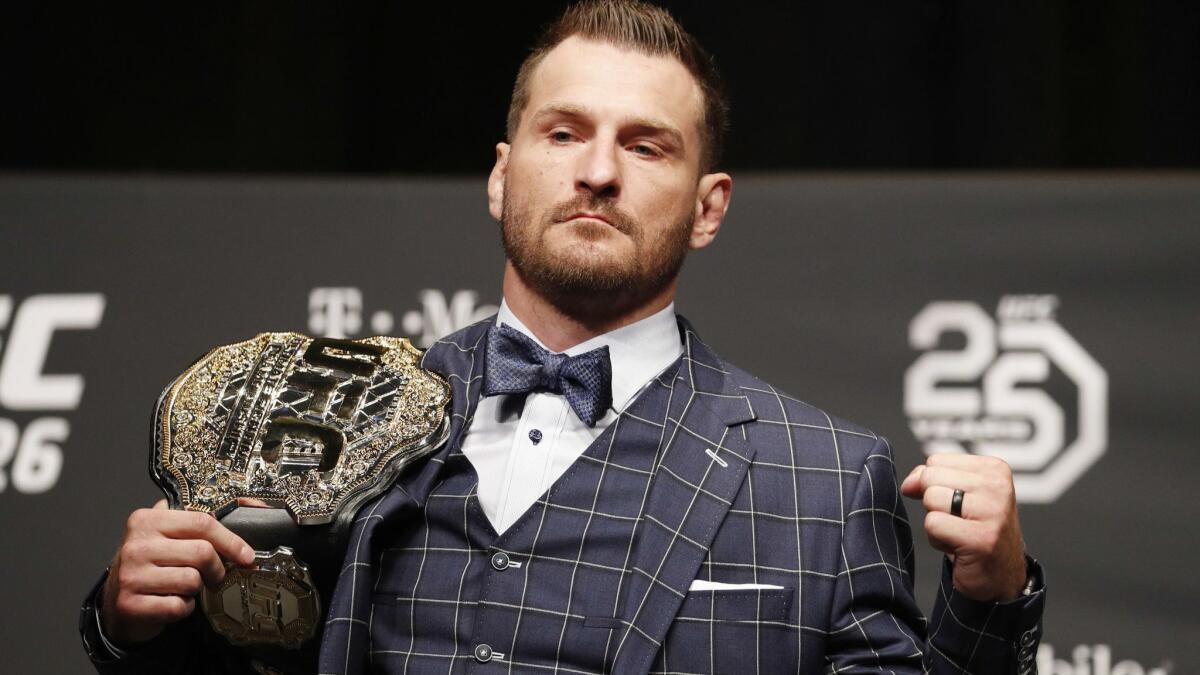 Stipe Miocic poses during a news conference July 5, 2018, in Las Vegas.