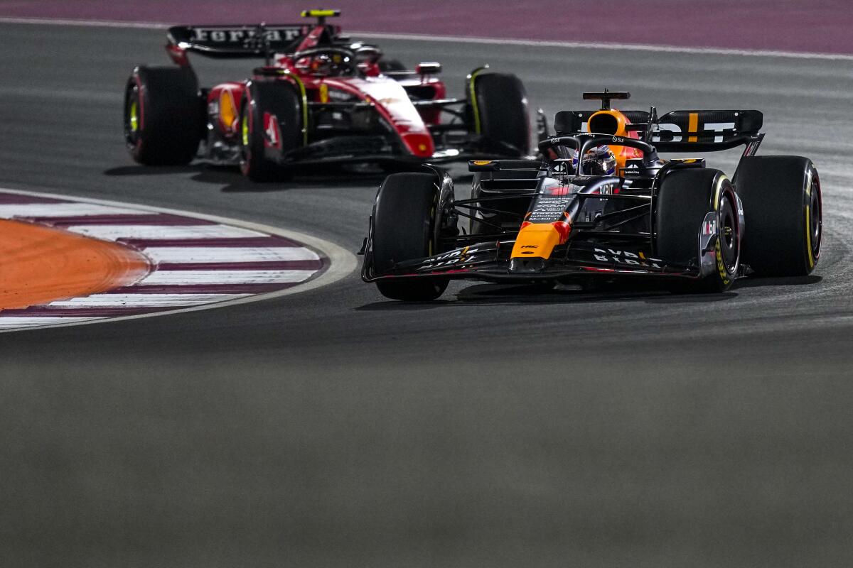 Max Verstappen races ahead of Ferrari's Carlos Sainz during the Qatar Grand Prix sprint on Saturday.