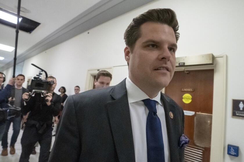 Rep. Matt Gaetz, R-Fla., a member of the House Judiciary Committee, walks past the House Oversight hearing with Michael Cohen, President Donald Trump's former personal lawyer, on Capitol Hill in Washington, Wednesday, Feb. 27, 2019. (AP Photo/J. Scott Applewhite)