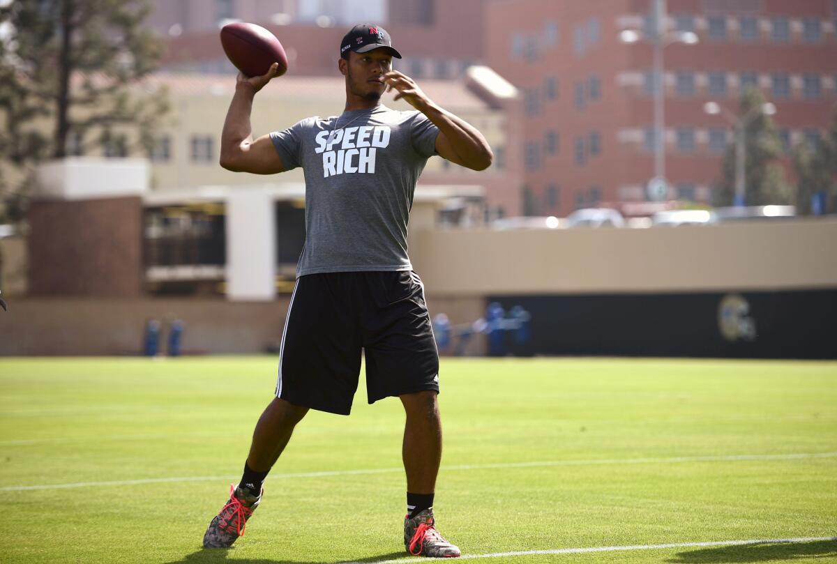 Quarterback Brett Hundley fires a pass during UCLA's pro day for NFL scouts in March.
