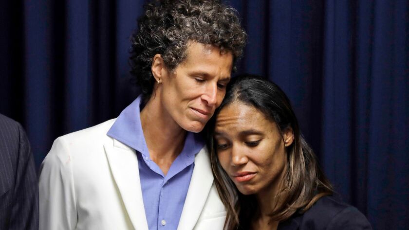 Bill Cosby accuser Andrea Constand, left, embraces prosecutor Kristen Feden during a news conference after Cosby was found guilty in his sexual assault retrial on April 26 in Norristown, Pa.
